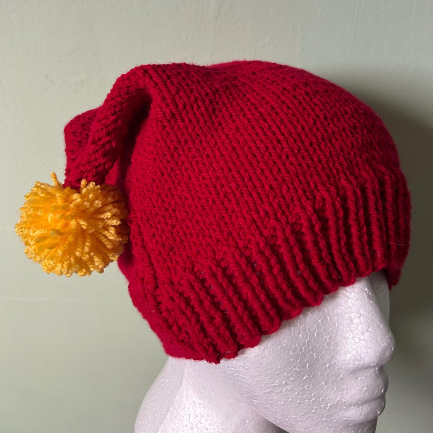 Red Knitted Hat with Yellow Pom Poms