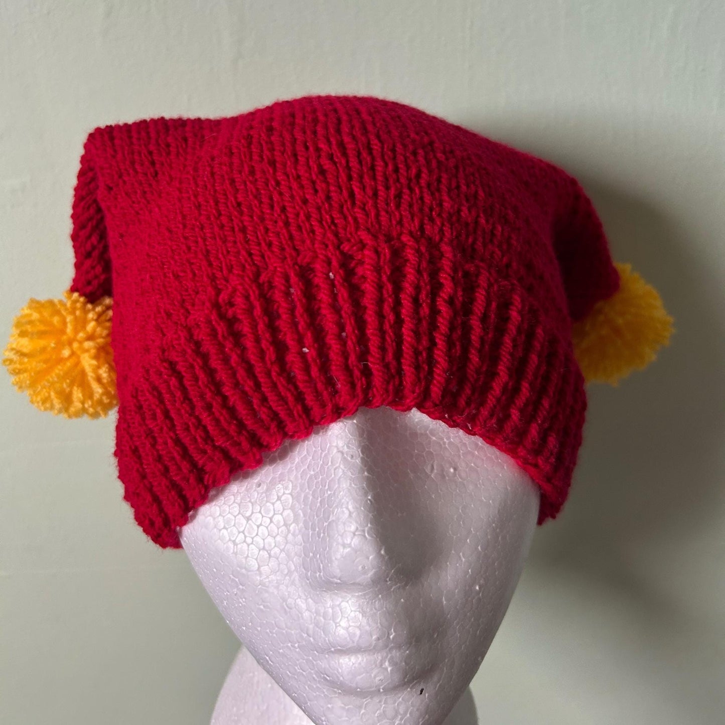 Red Knitted Hat with Yellow Pom Poms