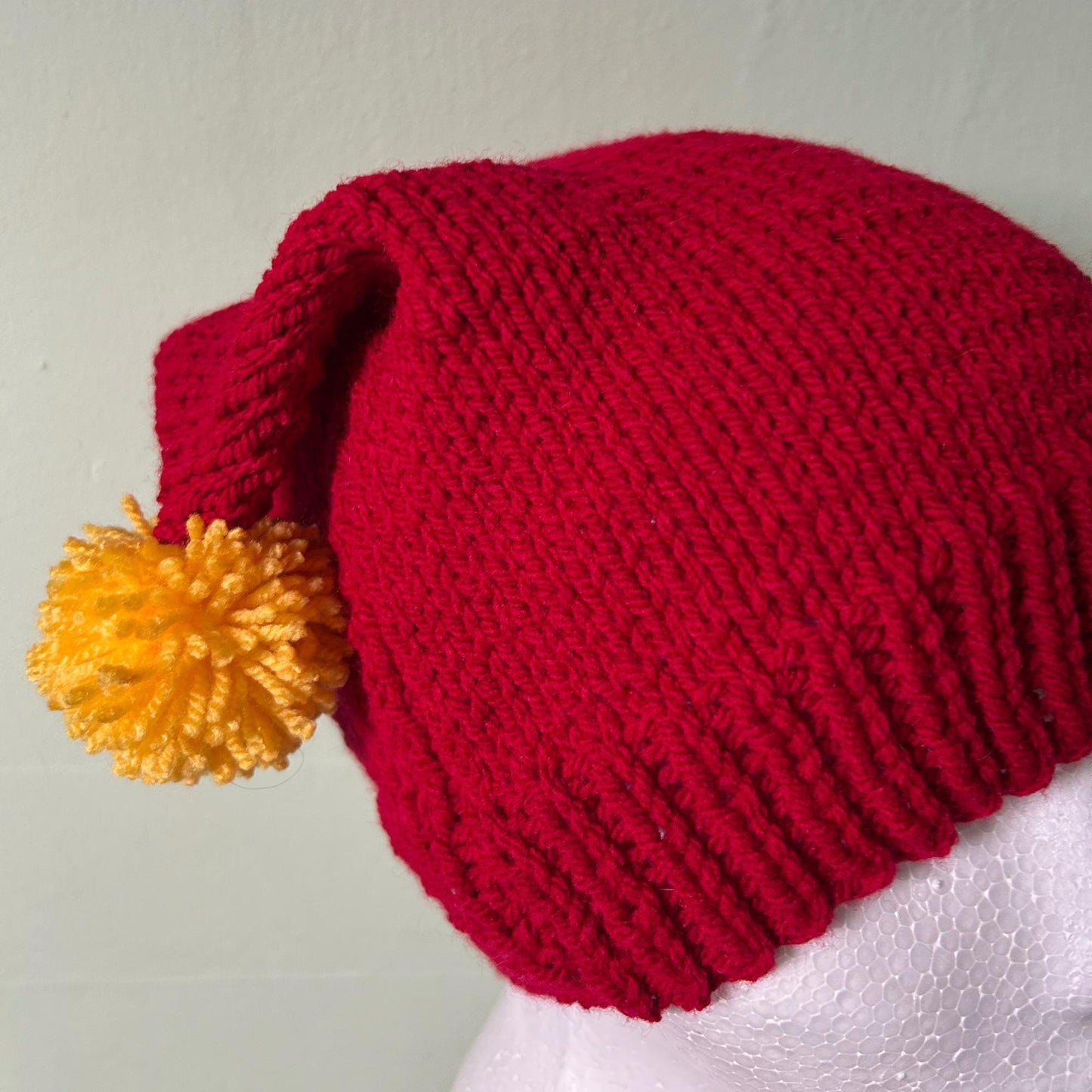 Red Knitted Hat with Yellow Pom Poms