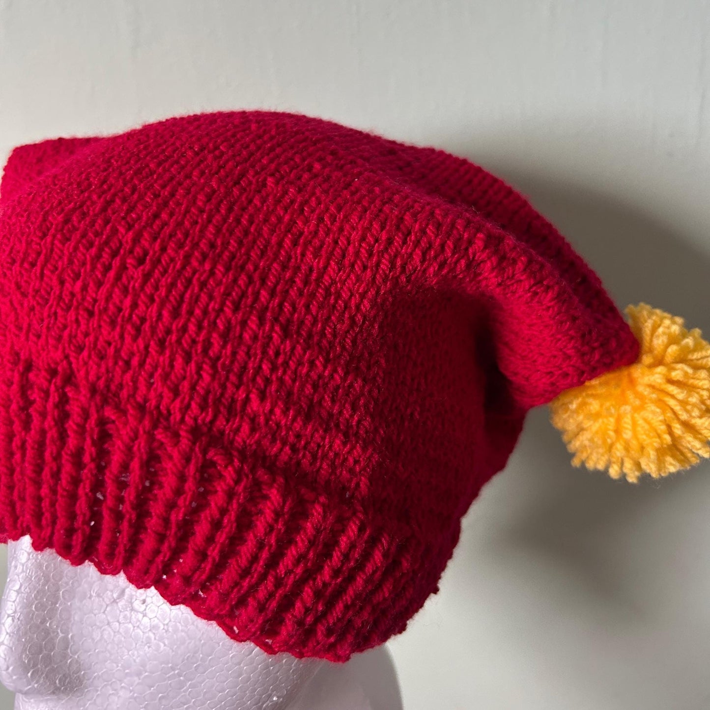 Red Knitted Hat with Yellow Pom Poms