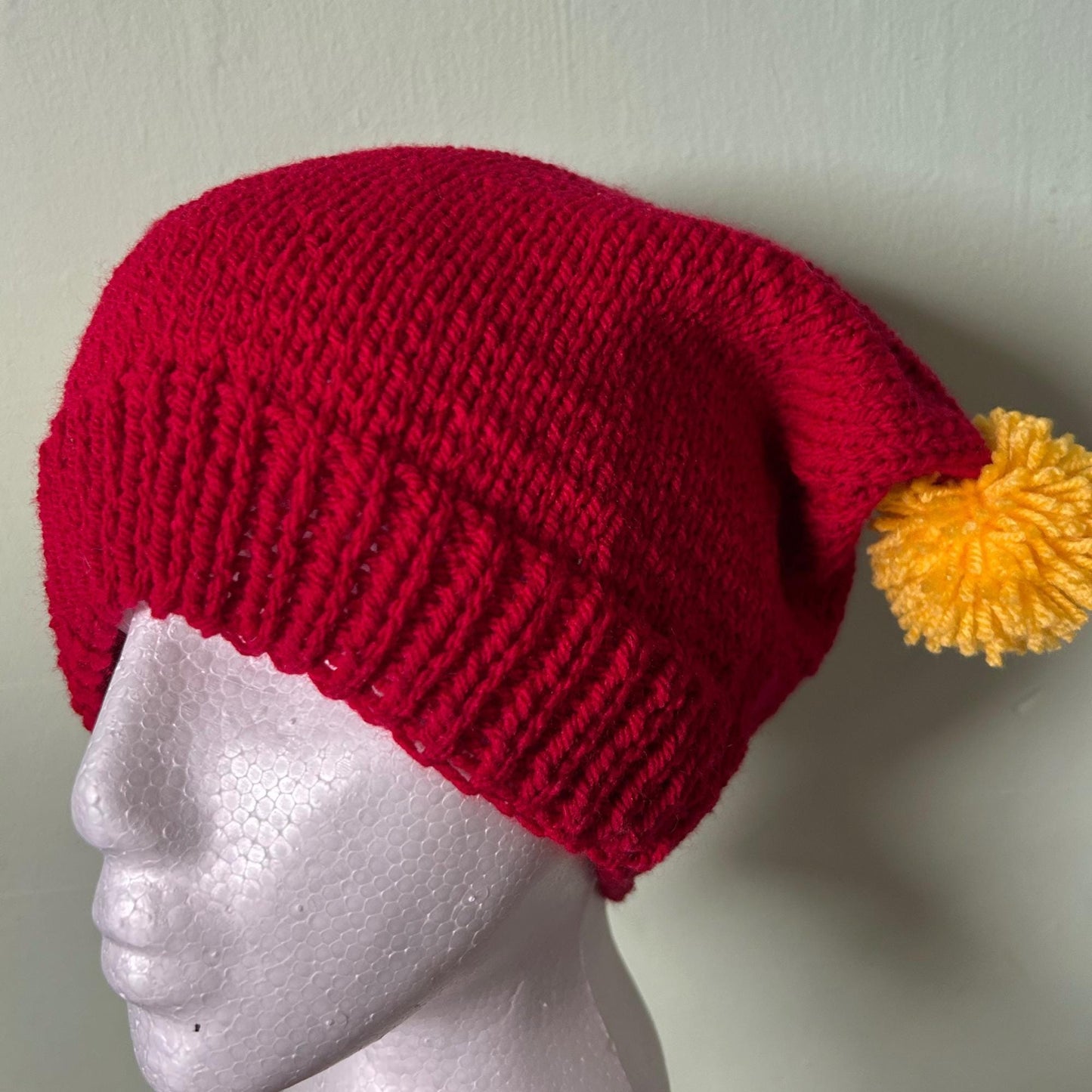 Red Knitted Hat with Yellow Pom Poms